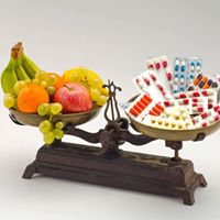 Scales balancing fresh vegetables and gut-healing foods