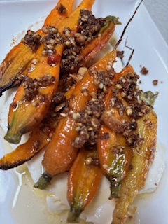 Roasted carrots over labneh, topped with golden pangrattato crumbs